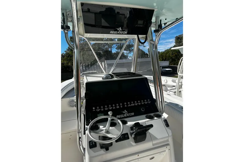 Slide: The Image of 2008 Regulator 26 Forward Seating boat console with steering wheel and controls. - 4