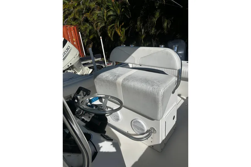 Slide: The Image of 2008 Regulator 26 Forward Seating boat interior with helm and seating area. - 7