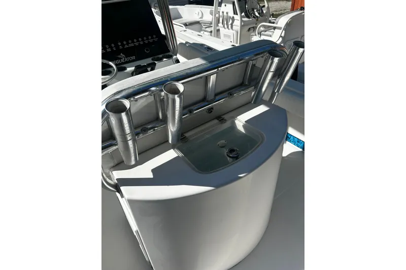 Slide: The Image of 2008 Regulator 26 Forward Seating boat console with rod holders and control panel. - 8
