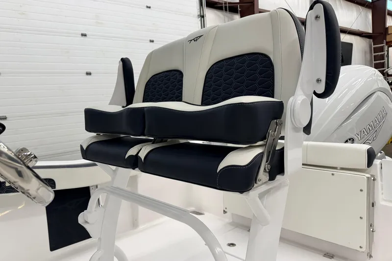 Slide: The Image of 2026 Tidewater 210 CC Adventure boat interior in a storage facility. - 11