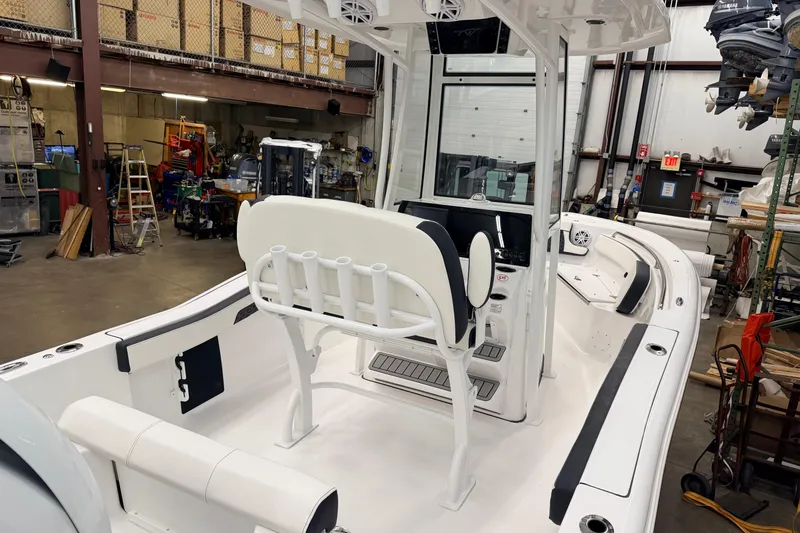 Slide: The Image of 2026 Tidewater 210 CC Adventure boat with Yamaha engine in showroom. - 7