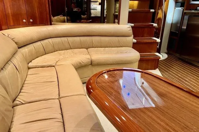 Slide: The Image of Luxurious interior of 2009 CRUISERS YACHT 520SC with plush seating and elegant wood finishes. - 15