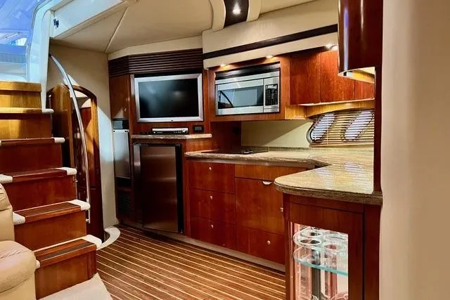 Slide: The Image of Luxurious 2009 CRUISERS YACHT 520SC interior with modern kitchen and entertainment area. - 16