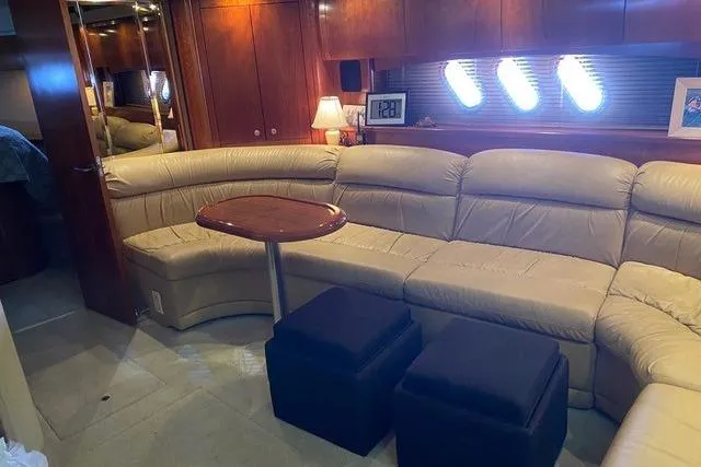 Slide: The Image of Luxurious interior of 2009 CRUISERS YACHT 520SC with leather seating and elegant wood finishes. - 5