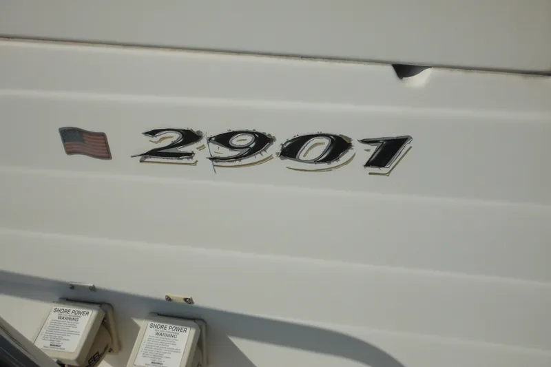 Slide: The Image of 2005 Seaswirl Striper 2901 Walkaround O/B boat with American flag decal. - 11