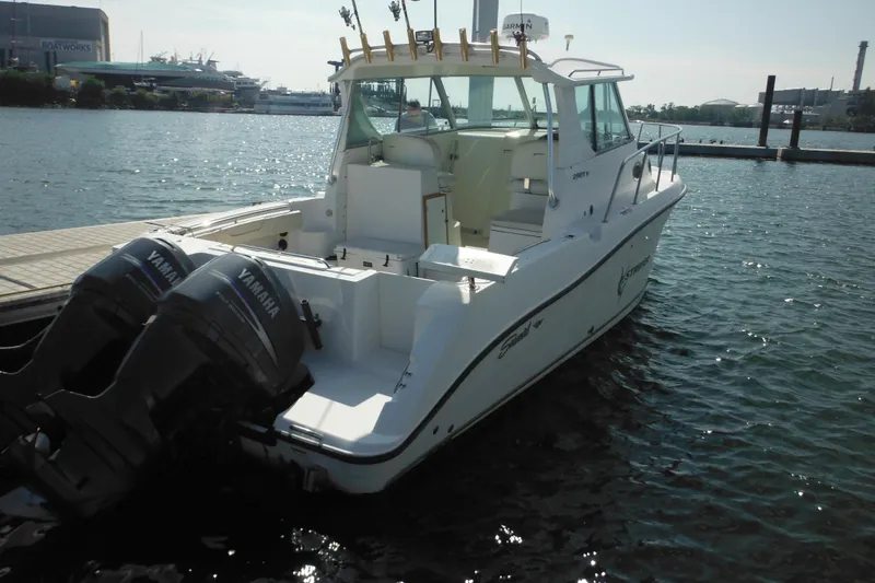 Slide: The Image of 2005 Seaswirl Striper 2901 Walkaround O/B with Yamaha engines docked at marina. - 15