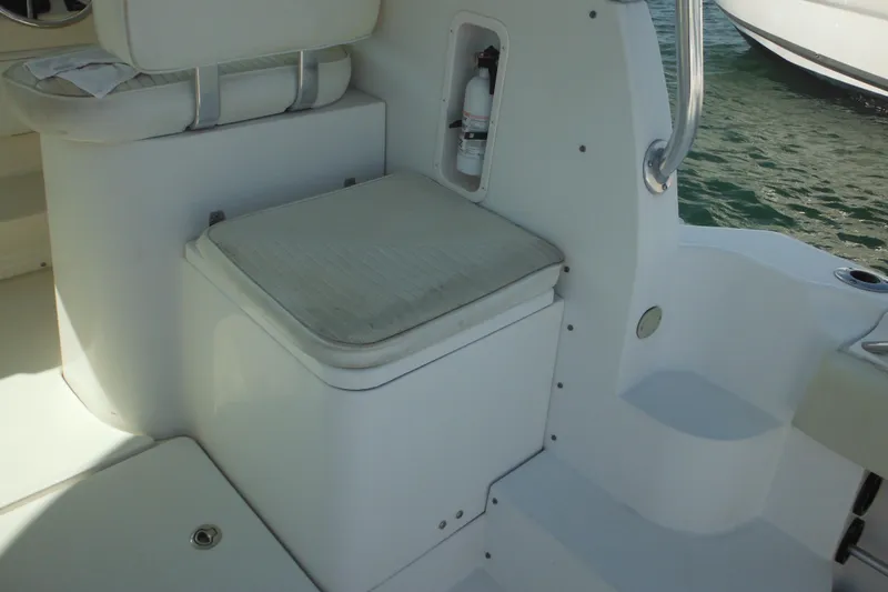 Slide: The Image of 2005 Seaswirl Striper 2901 Walkaround O/B boat interior with seating and storage. - 18