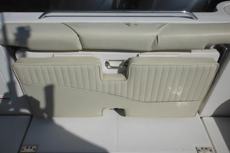 Slide: The Image of 2005 Seaswirl Striper 2901 Walkaround O/B boat seat with white upholstery and foldable design. - 20