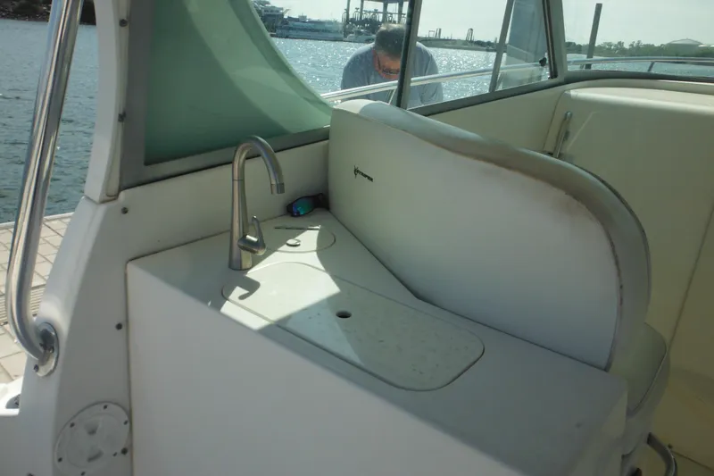 Slide: The Image of 2005 Seaswirl Striper 2901 Walkaround O/B interior with sink and seating area. - 22