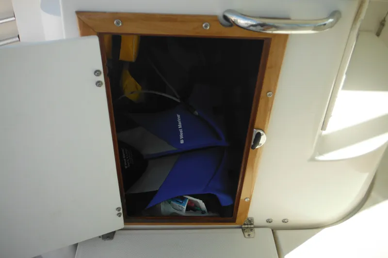 Slide: The Image of Open storage compartment on 2005 Seaswirl Striper 2901 Walkaround O/B boat. - 30