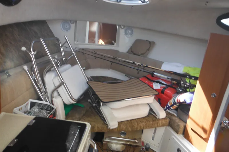 Slide: The Image of Interior of 2005 Seaswirl Striper 2901 Walkaround O/B with fishing gear and seating. - 40