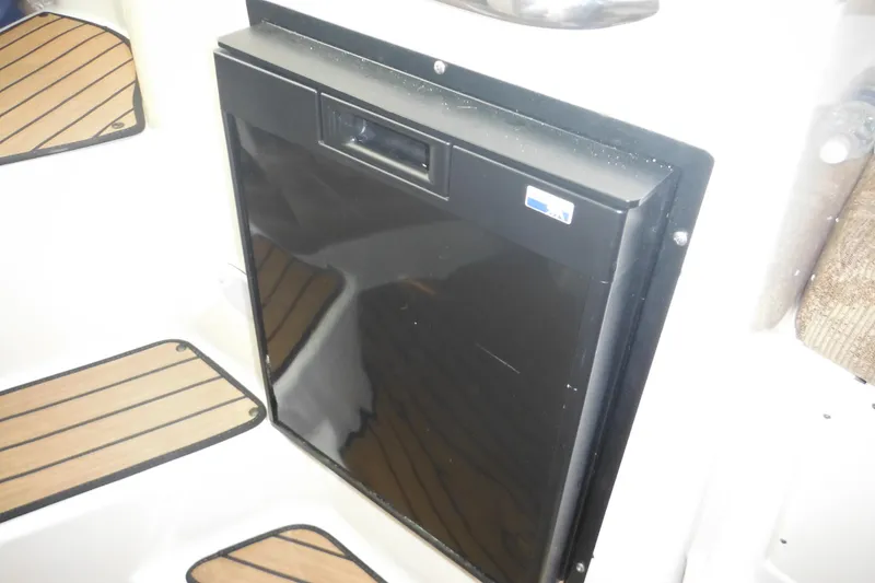 Slide: The Image of 2005 Seaswirl Striper 2901 Walkaround O/B interior with black panel and wooden flooring. - 44