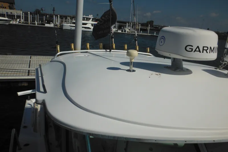 Slide: The Image of 2005 Seaswirl Striper 2901 Walkaround O/B with Garmin radar at dock. - 56