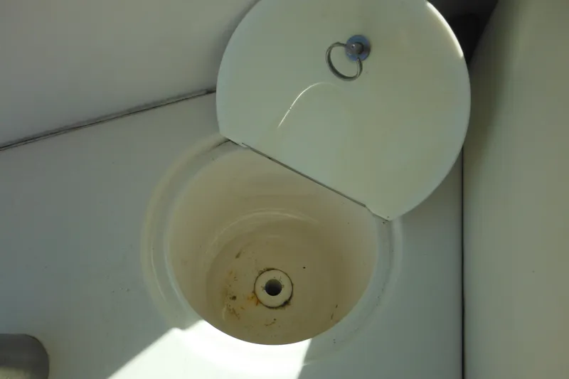 Slide: The Image of Open storage compartment on 2005 Seaswirl Striper 2901 Walkaround O/B boat. - 58