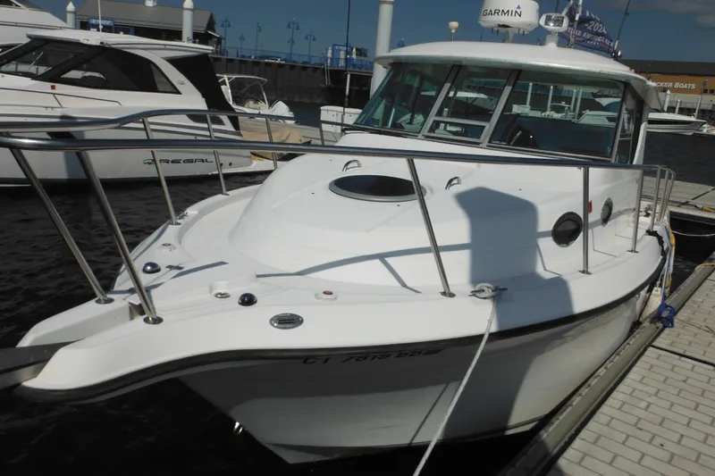 Slide: The Image of 2005 Seaswirl Striper 2901 Walkaround O/B docked at marina. - 6