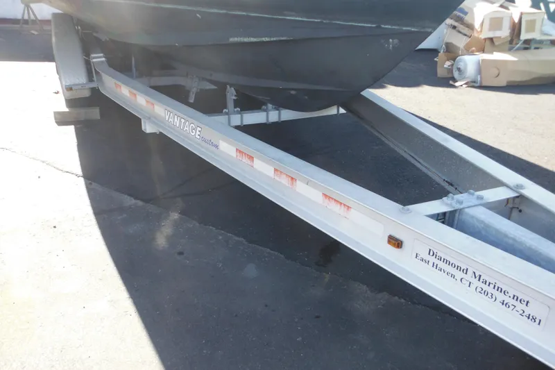 Slide: The Image of 2005 Seaswirl Striper 2901 Walkaround O/B on Vantage custom trailer. - 64