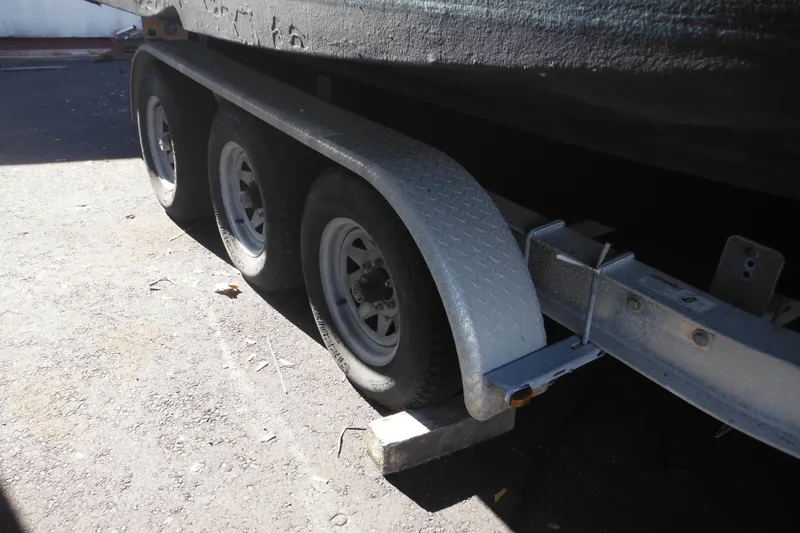 Slide: The Image of Trailer for 2005 Seaswirl Striper 2901 Walkaround O/B with triple axles. - 67