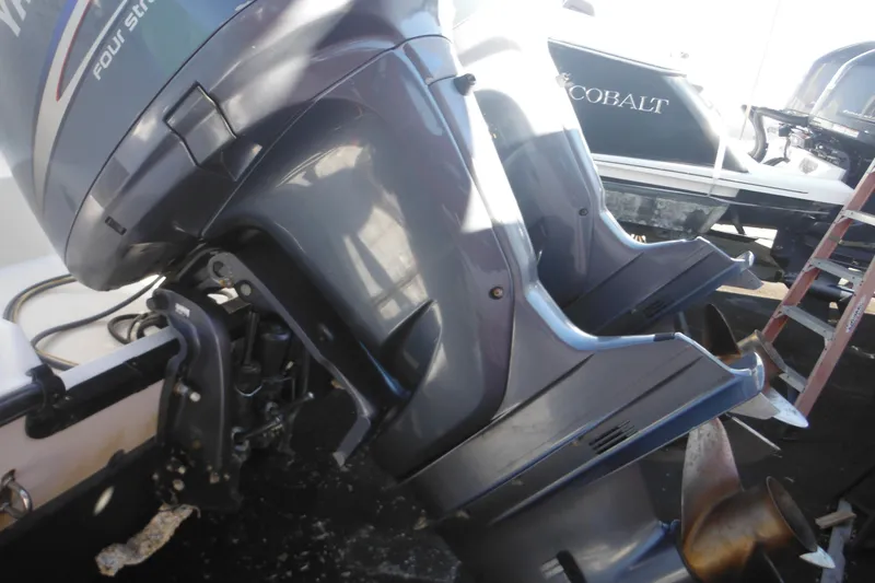 Slide: The Image of 2005 Seaswirl Striper 2901 Walkaround O/B with Yamaha outboard motor, docked. - 68