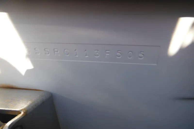 Slide: The Image of 2005 Seaswirl Striper 2901 Walkaround O/B hull identification number close-up. - 70