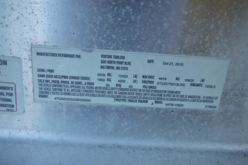 Slide: The Image of Label on Venture Trailers, dated October 21, 2015, with specifications and compliance details. - 74