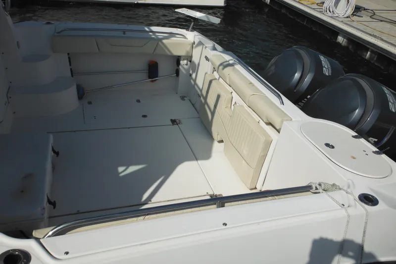Slide: The Image of 2005 Seaswirl Striper 2901 Walkaround O/B boat interior with seating and twin outboard engines. - 8