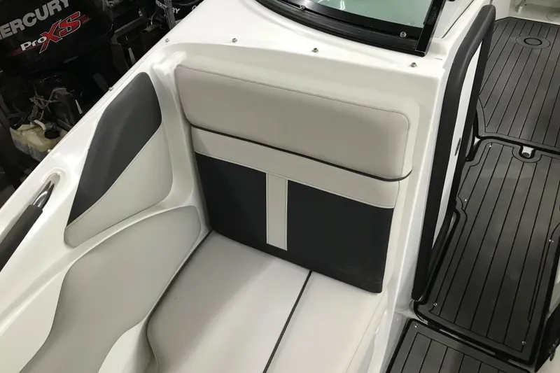 Slide: The Image of 2018 Rinker QX26 BR boat interior with sleek seating and modern design. - 14