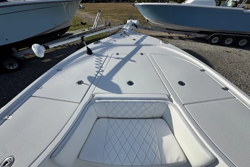 Slide: The Image of 2025 Blazer Bay 2700 Hybrid boat deck with seating and storage compartments. - 20