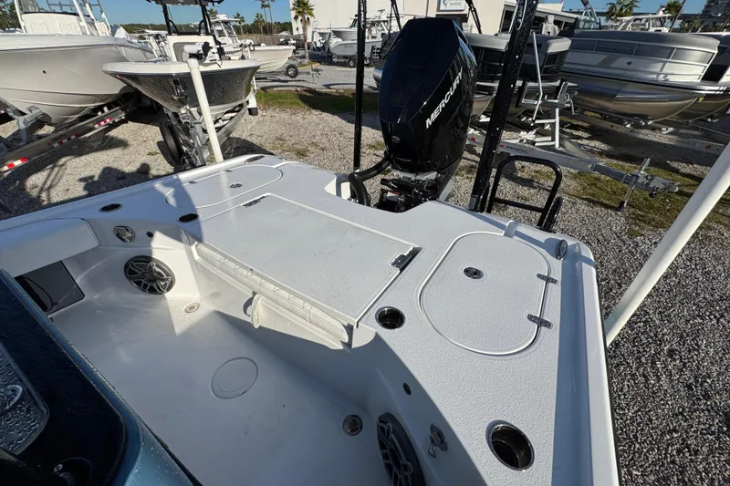 Slide: The Image of 2025 Blazer Bay 2700 Hybrid boat with Mercury engine, docked outdoors. - 38