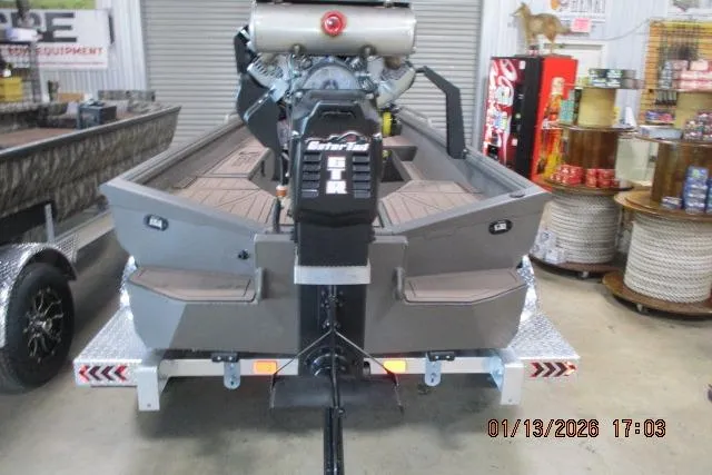 Slide: The Image of 2026 Reaper Boats 656 MUD BOAT on trailer in showroom setting. - 4