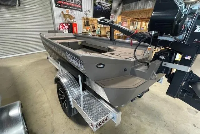 Slide: The Image of Reaper Boats 656 MUD BOAT 2026 in a workshop. - 6