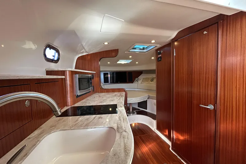 Slide: The Image of Luxurious interior of 2018 Pursuit OS 385 Offshore boat with modern amenities. - 18