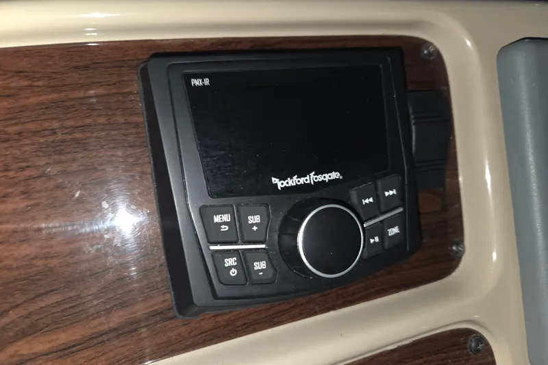 Slide: The Image of Rockford Fosgate audio system in 2005 Chaparral Signature 310 boat dashboard. - 14