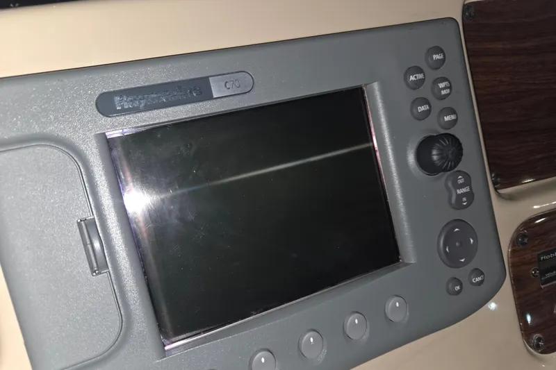 Slide: The Image of Control panel of a 2005 Chaparral Signature 310 boat. - 15