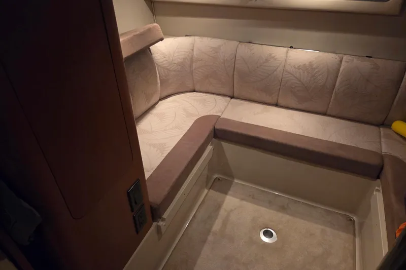Slide: The Image of Interior seating area of 2005 Chaparral Signature 310 boat with beige upholstery. - 25