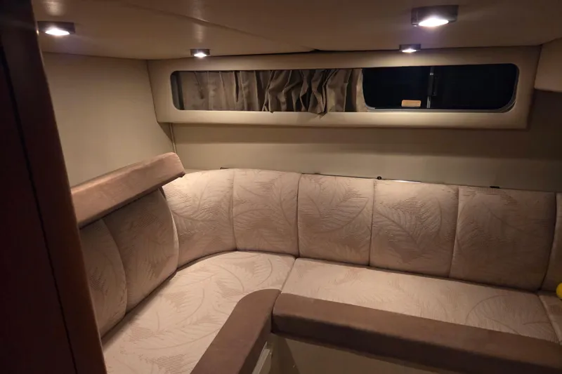 Slide: The Image of 2005 Chaparral Signature 310 interior with cozy seating and ambient lighting. - 26