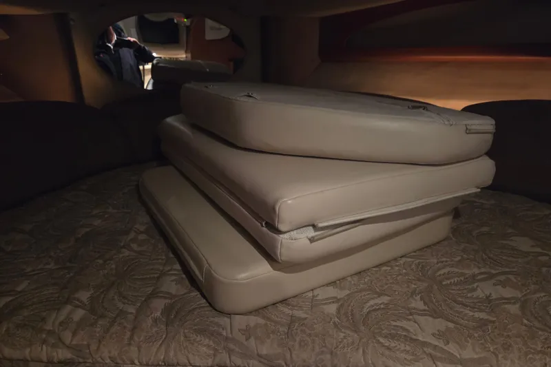 Slide: The Image of Cushions stacked inside 2005 Chaparral Signature 310 boat cabin. - 27