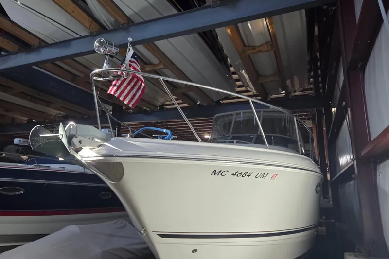Slide: The Image of 2005 Chaparral Signature 310 boat in storage with American flag displayed. - 28