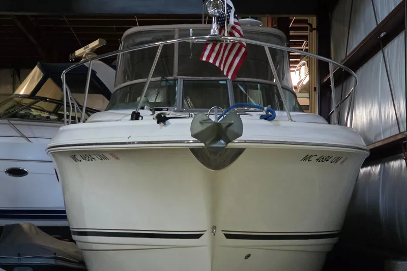 Slide: The Image of 2005 Chaparral Signature 310 boat in storage with American flag displayed. - 4