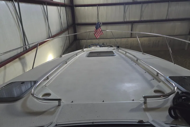 Slide: The Image of 2005 Chaparral Signature 310 boat in storage with American flag displayed. - 5