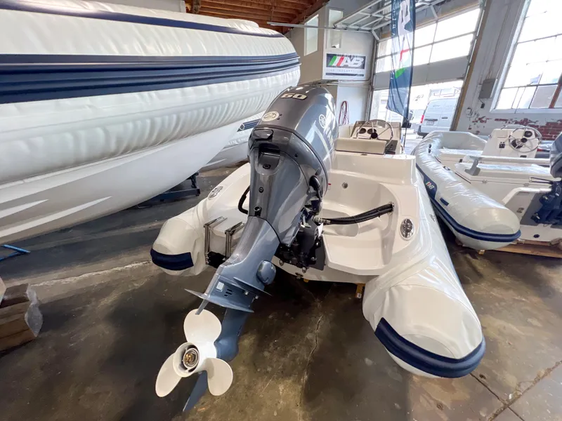 Slide: The Image of 2023 AB Inflatables Nautilus 13 DLX boat with outboard motor in showroom. - 12