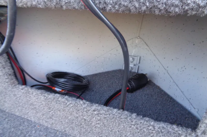 Slide: The Image of 2024 Lund 1400 Fury Tiller interior wiring and storage compartment. - 16