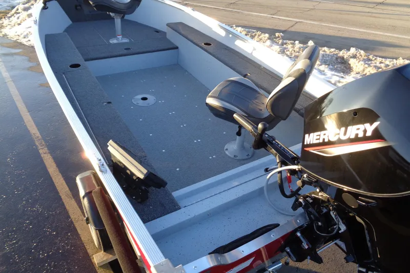 Slide: The Image of 2024 Lund 1400 Fury Tiller boat with Mercury engine, interior view. - 17