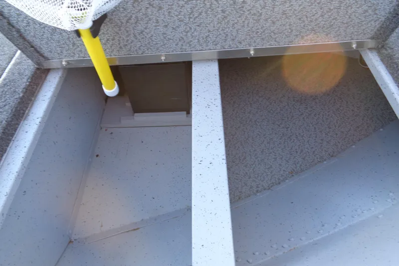 Slide: The Image of 2024 Lund 1400 Fury Tiller interior storage compartment with fishing net. - 24