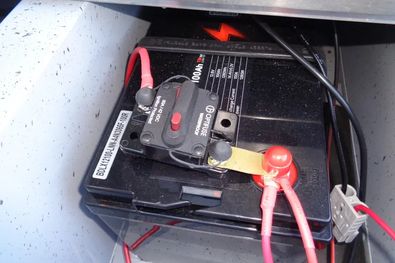 Slide: The Image of Battery setup in 2024 Lund 1400 Fury Tiller boat, featuring Optifuse circuit breaker. - 5