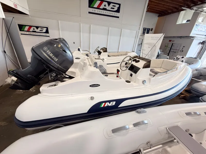 The Image of 2024 AB Inflatables Nautilus 13 DLX boat with Yamaha engine in showroom. - 0