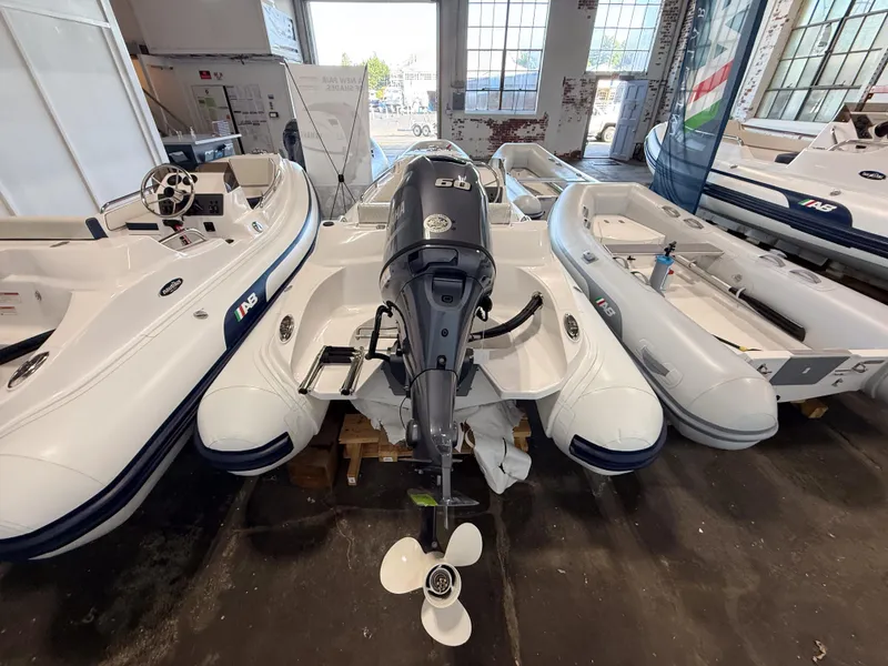 Slide: The Image of 2024 AB Inflatables Nautilus 13 DLX boat with Yamaha outboard motor in showroom. - 3