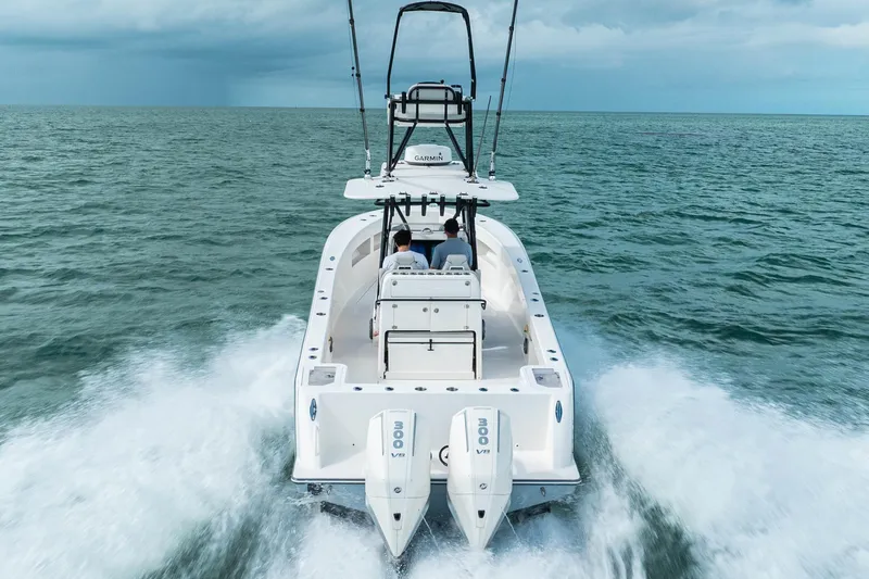 Slide: The Image of SeeVee 32 boat cruising on open water, 2099 model, rear view. - 12