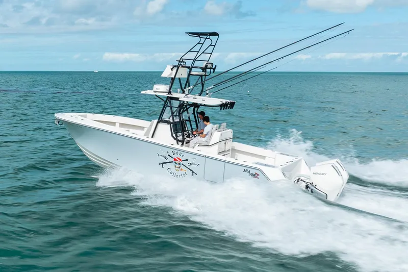 Slide: The Image of High-speed SeeVee 32 boat cruising on ocean, 2099 model, with fishing rods and clear skies. - 14