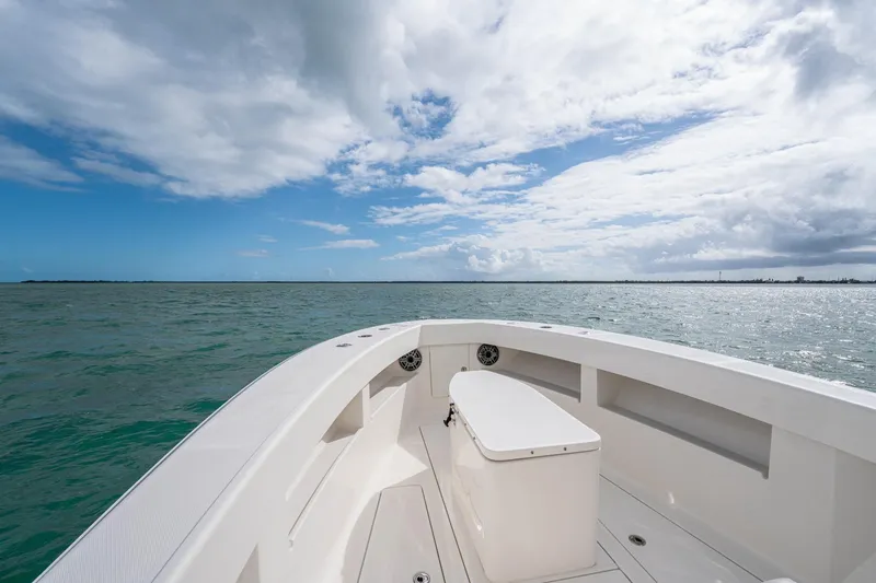 Slide: The Image of SeeVee 32 boat on open water under a partly cloudy sky, year 2099. - 16