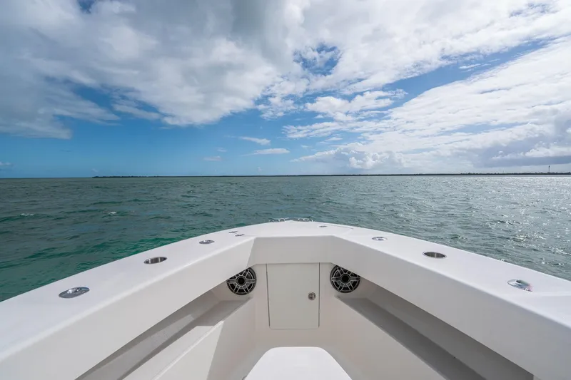 Slide: The Image of Bow view of SeeVee 32 boat, 2099 model, on open sea under cloudy sky. - 17